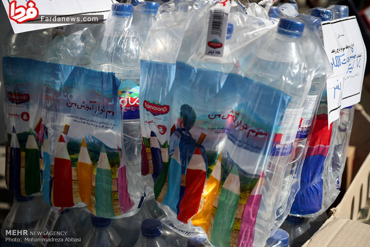 عکس: کشف مشروبات الکی در بطریهای آب معدنی مشهور