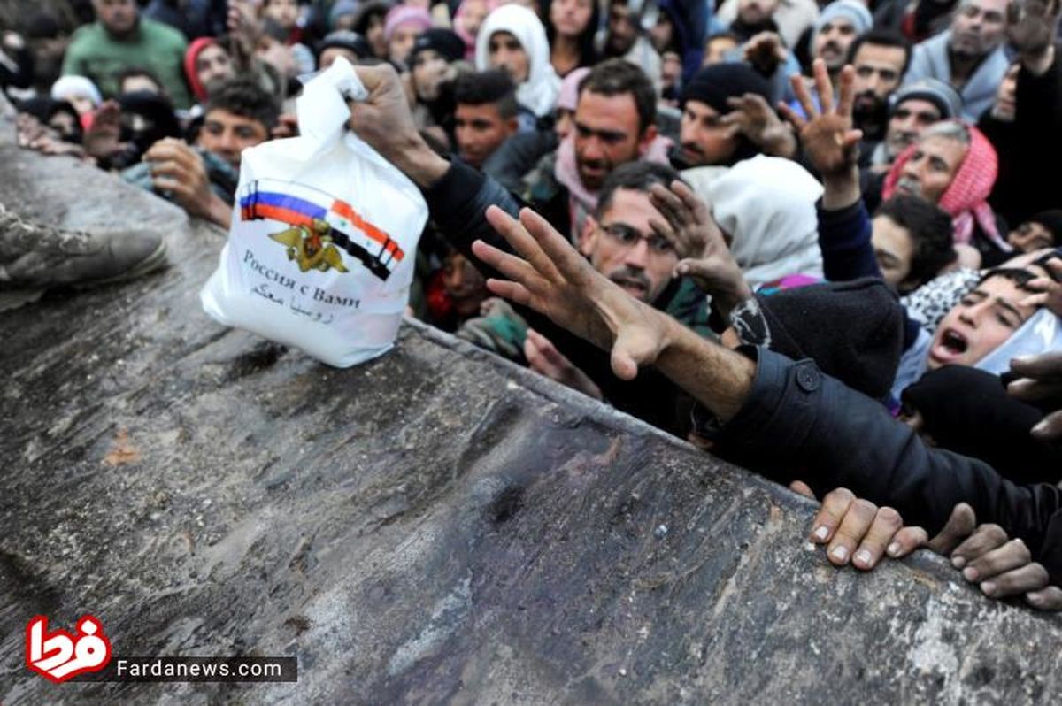 عکس: شعار روسیه روی کمک‌های ارسالی به حلب